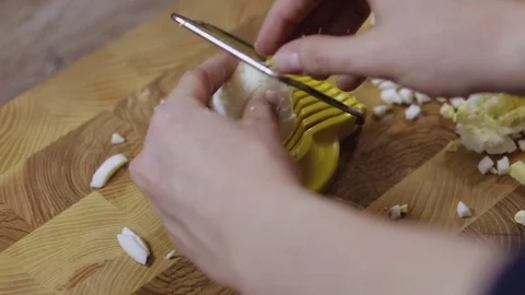 Cutting eggs of egg slicer close-up Stock Footage 73099397
