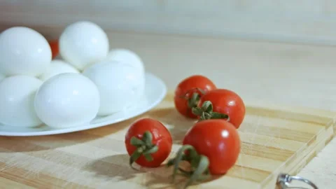 Cutting eggs for olive salad, Russian salad Stock Footage 144426461