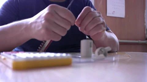 Cutting electric wire with knife. Stock Footage 229269596