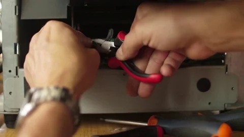 Cutting electrical cables with pliers slow motion Stock Footage 79836806