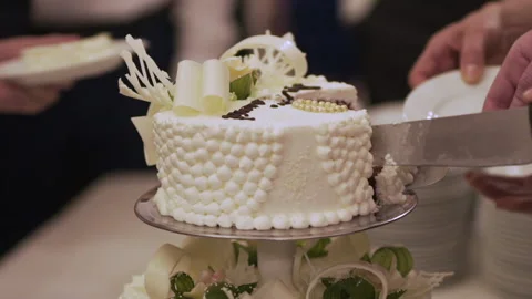 Cutting An Elegant Wedding Cake During A Ceremony Stock Footage 304873851