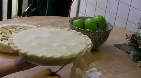 Cutting Excess Dough Off of Pie Crust Before Baking Stock Footage 33602401