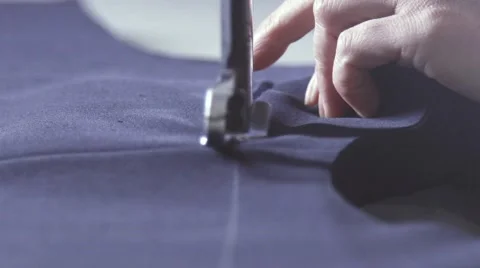 Cutting fabric. Blue cut out fabric for clothing in a textile factory Video stock 68970525