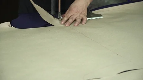 Cutting fabric machine closeup. A large machine for cutting fabrics. Sewing Stock Footage 74431300