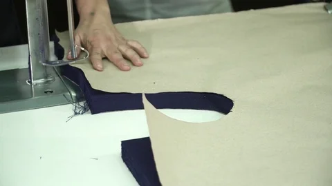 Cutting fabric machine. A large machine for cutting fabrics. Sewing production Stock Footage 74431093