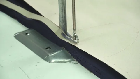 Cutting fabric machine. Textile factory. A large machine for cutting fabrics Stock Footage 74430951