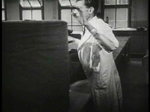 Cutting fabric from a pattern to make clothes Stock Footage 74777735