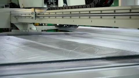 Cutting fabrics according to patterns using automatic cutting complex for fabric Stock Footage 247828397