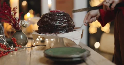 Cutting festive chocolate pie during a celebration Stock Footage 145983438
