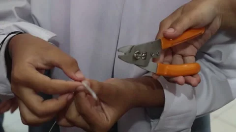 Cutting fiber optic cables for internet network connections Stock Footage 307371176