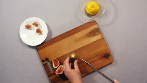 Cutting figs in half and quarters Stock Footage 165598675