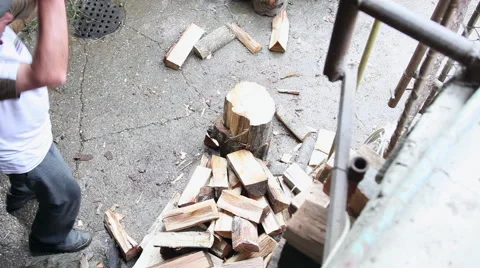 Cutting firewood, strong old man chopping logs, farm, ax, hard worker Stock Footage 41265345