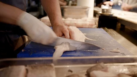 Cutting fish in a restaurant Stock-Footage 117993701