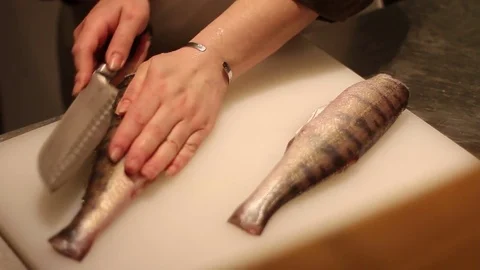 cutting fish on white Board | Stock Video | Pond5
