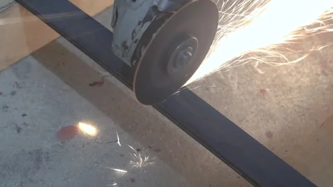 Cutting a flat bar or flat steel bar with an angle grinder Stock Footage 302303003