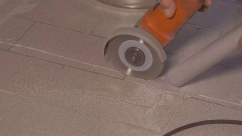 Cutting floor with portable grinder Stock Footage 76896323