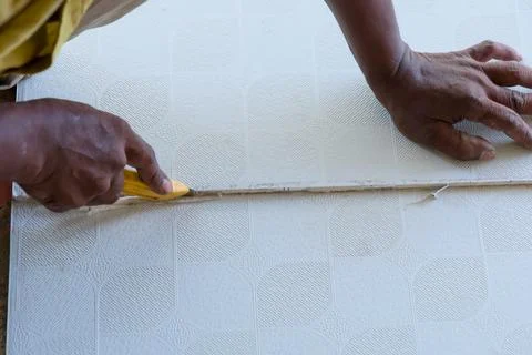 Cutting flooring material with precision in a workshop Stock Photos