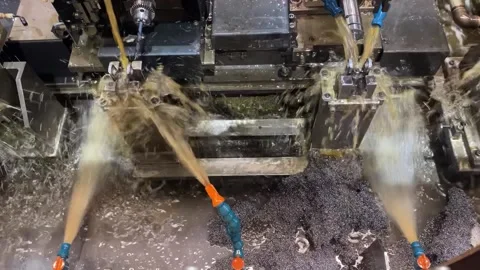 Cutting Fluid Spraying onto Metal Workpiece During Machining Stock Footage 339512731