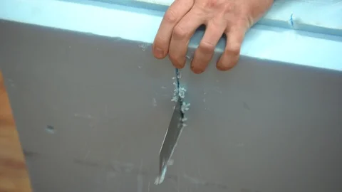 Cutting foam with a hand saw Stock Footage 101730164
