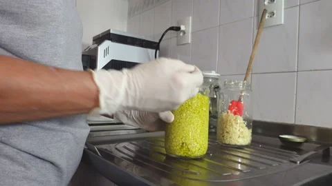 Cutting in food processor, mixing with olive oil and making garlic conserves. Stock Footage 148747484