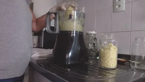 Cutting in food processor, mixing with olive oil and making garlic conserves. Stock Footage 148747586