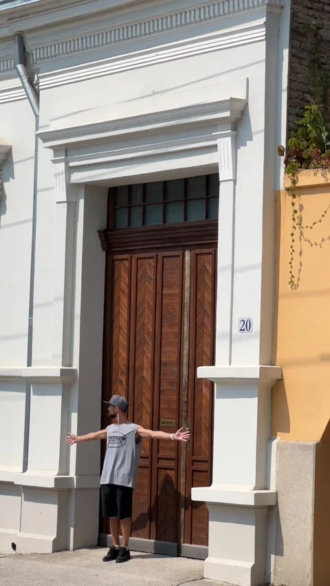 Cutting frames of an ancient city with beautiful wooden doors. Subotica, Serbia Stock Footage 248470179