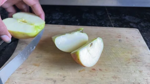 Cutting a Fresh Apple into Small Slices with a Knife — Close-Up Food Stock Footage 321127564