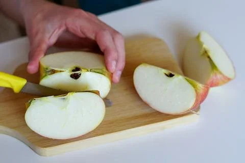 Cutting Fresh Apples in the Kitchen Stock Photos