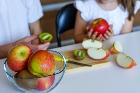 Cutting Fresh Apples in the Kitchen Stock Photos