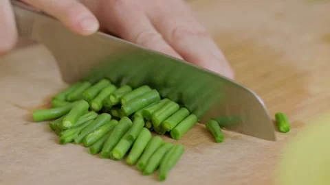 Cutting fresh beans for lunch Stock Footage 250183109