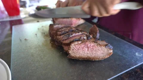 Cutting fresh cooked tri tip beef Stock Footage 209172662