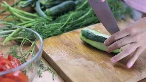 Cutting fresh cucumbers Stock Footage 94474500
