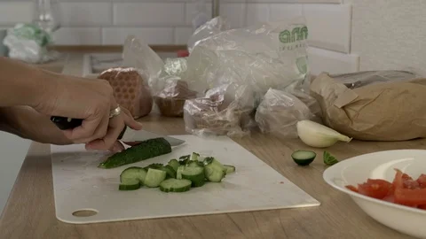 Cutting fresh cucumbers Stock Footage 97023413