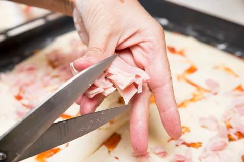 Cutting fresh ham Stock Photos