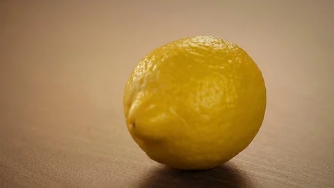 Cutting a Fresh Lemon on the Kitchen Board Stock Footage 71824564