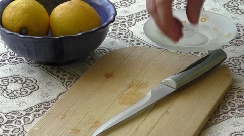 Cutting fresh lemon into pieces Stock Footage 48419624