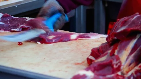 Cutting Fresh  Meat in a Butchery Stock-Footage 76335583