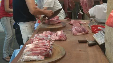 Cutting fresh meat for sale, street market, Hong Kong, China Stock Footage