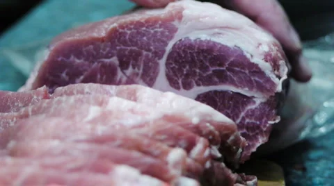Cutting fresh meat to slices Stock Footage 1088429