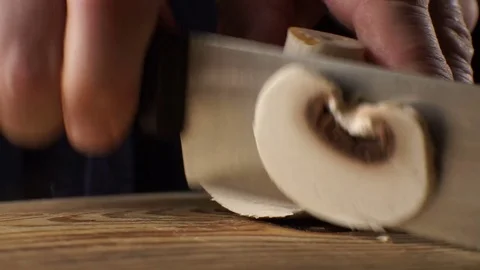 Cutting fresh mushrooms side view. Video Stock Footage 85329455