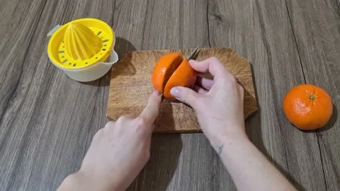 Cutting Fresh Oranges To Squeezing Oranges And Make Orange Juice Stock Footage 152650647