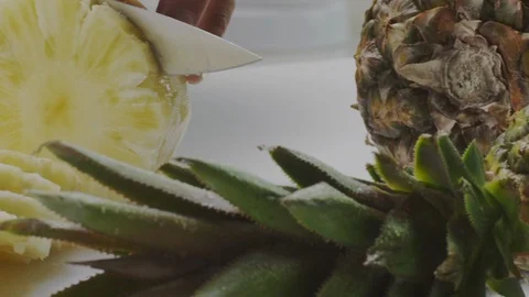 Cutting fresh pineapple Stock Footage 98298147