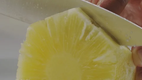 Cutting fresh pineapple Stock Footage 98298174