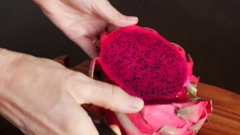 Cutting Fresh Pitaya or Dragon Fruit On Wooden Table Stock Footage 71891390