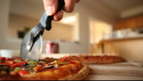 Cutting fresh pizza Stock Footage 10833301