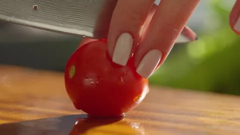Cutting fresh produce on a kitchen cutting board Stock Footage 336466765