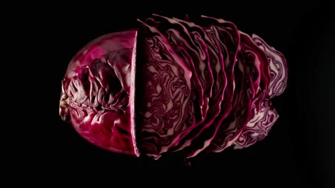 Cutting A Fresh Red Cabbage On A Black Table, Stop motion Видео 147369864