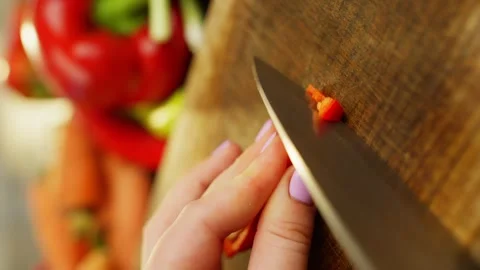 Cutting Fresh Red Chili Pepper for Delicious Spicy Recipes Video stock 296363496
