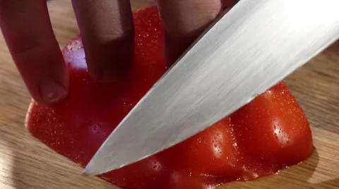Cutting a fresh red pepper into strips Stock Footage 8573583