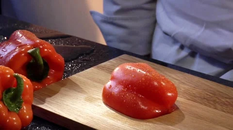 Cutting a fresh red pepper into strips Stock Footage 8573587